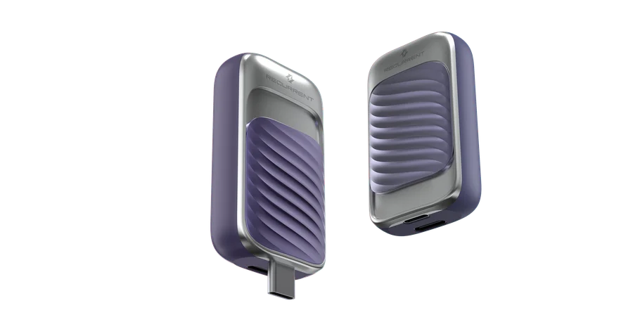 Two Recurrent SuperCap pods in lilac and brushed metal, one with a USB-C plug